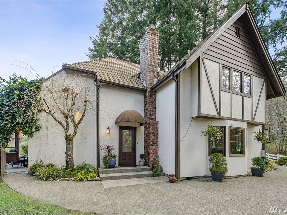Welcome home to this unique enchanting cottage nestled on 1.4 acres in Gig Harbor. 