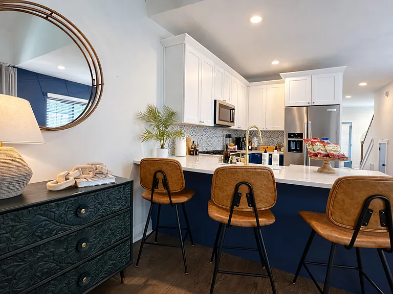 Designer kitchen and entertainment space stocked with games and built-in entertainment to break the ice!