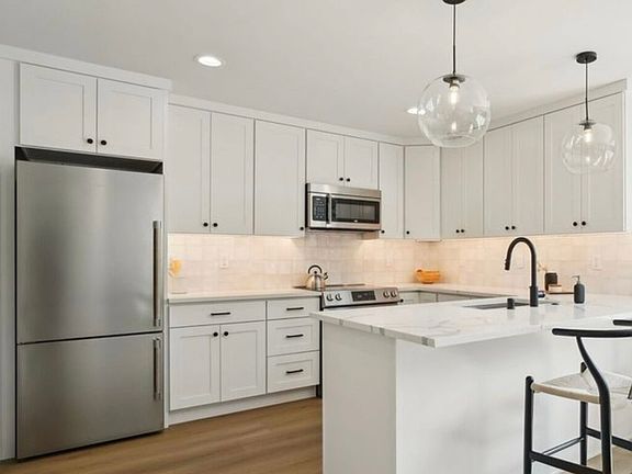 Kitchen with stainless steel appliances.