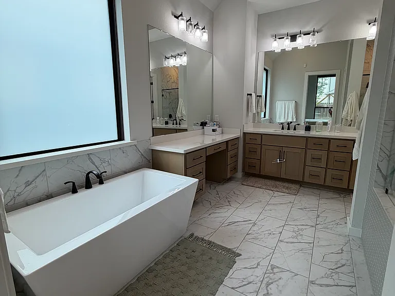 Master bath with soaking tub and separate vanity
