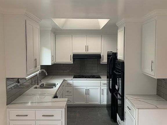 Kitchen with adjacent breakfast nook opens to private patio