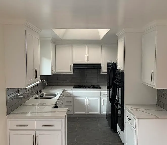 Kitchen with adjacent breakfast nook opens to private patio