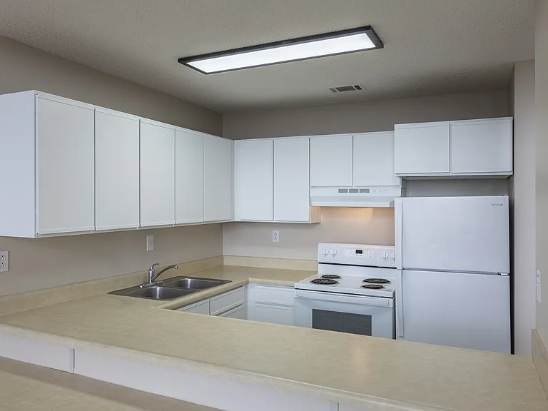 Kitchen with white cabinets at Rosewater.