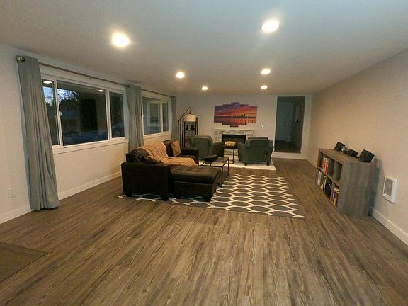 Spacious Living Room. New Luxury Vinyl Plank flooring throughout entire home.