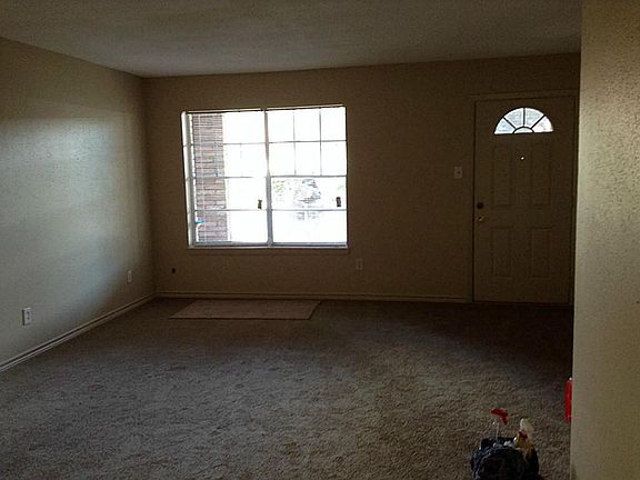 Den with new carpet, blinds and light