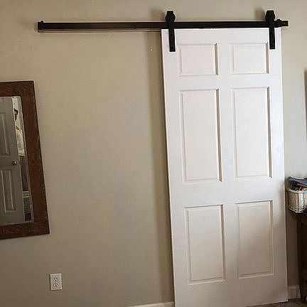 Barndoor from master bedroom to bathroom en suite.
