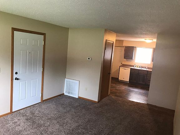 Large living room with coat closet.