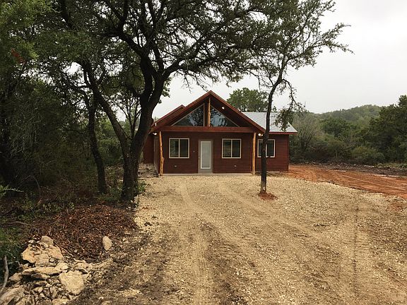 Front of Cabin with driveway andoff road parking