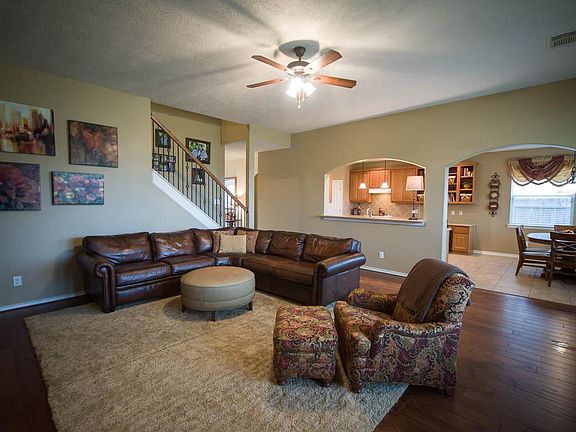 Beautiful hand-scraped hardwood floors, wrought iron spindles and...