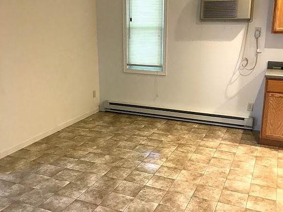 Dining room area, opent to kitchen and livingroom. Air conditioner includes a remote control.