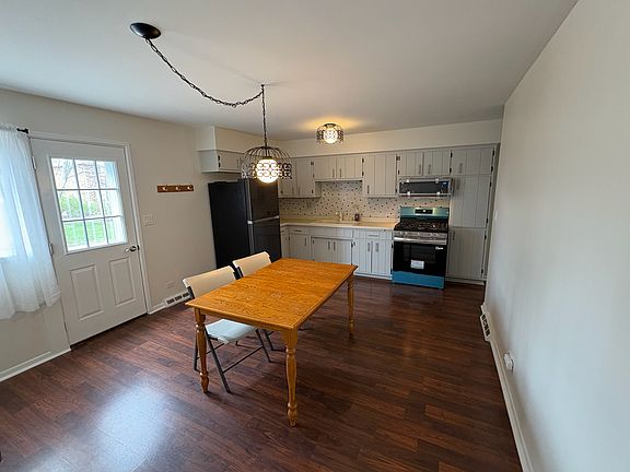 4 foot table to show scale. Brand new microwave and oven/range. Newer fridge.