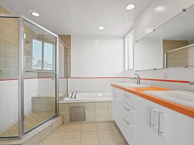 Spacious Bathroom with Large Stand-Up Shower and Full-Size Bathtub