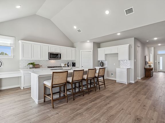 Kitchen in the Wimbledon home plan by Trophy Signature Homes - REPRESENTATIVE PHOTO