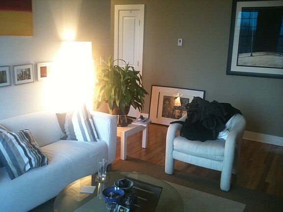 The living room has city views and a modern layout. But let'