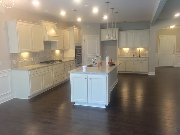 Large open kitchen complete with granite countertops