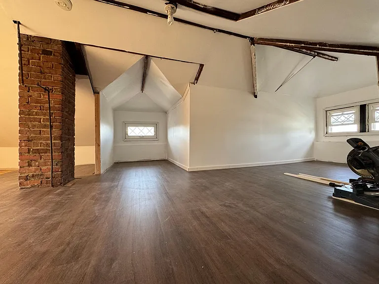Attic will be finished by the time you move in.