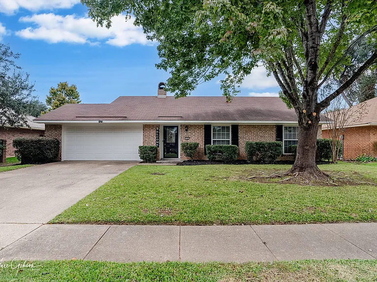 View of front of home from a distance.