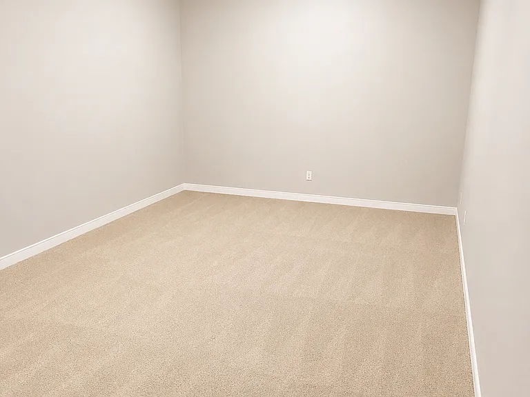 Large bonus room downstairs behind garage for storage or game room.