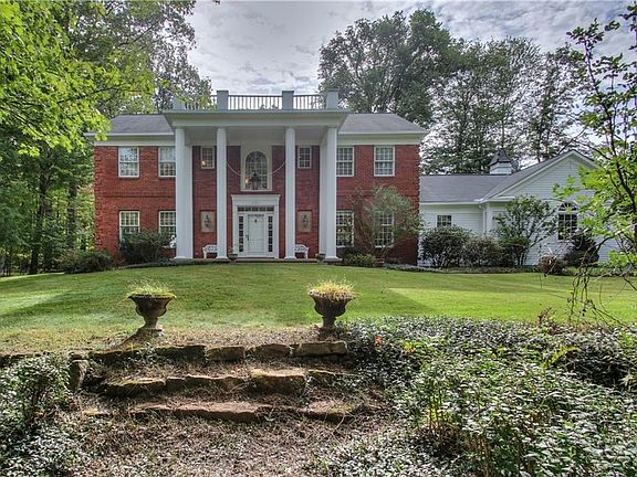 A beautiful view of the house from the front yard garden court yard.