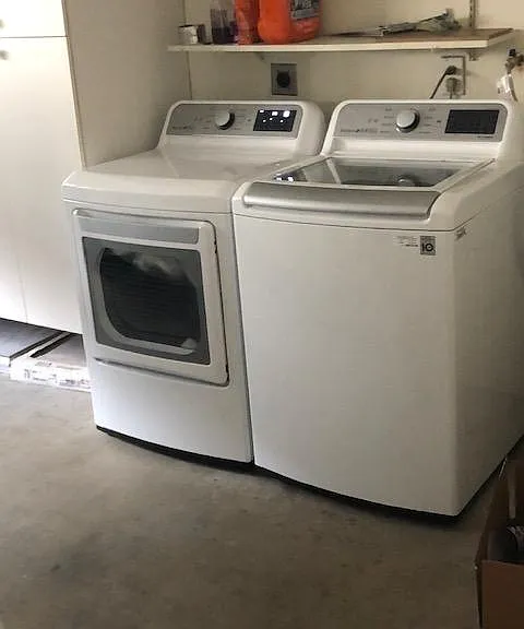 In unit smart washer and dryer inside two car attached garage.