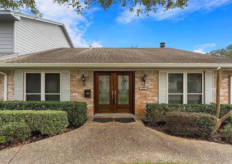 Front of townhome; beautiful double wood doors.