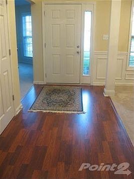 Cherry colored laminate - always shiny and clean. Walk into this well maintained home and wide open 