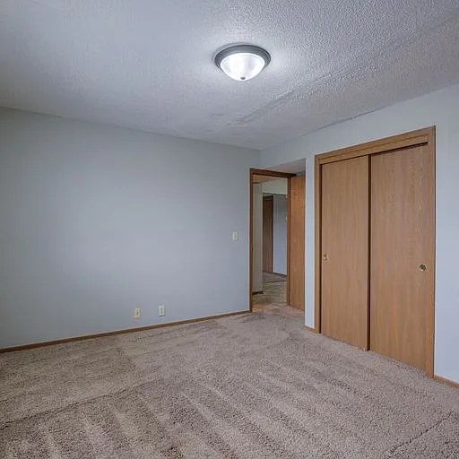 Room with sliding closet doors at 108 Blondo.
