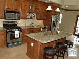Highly Upgraded Kitchen with Maple Cabinetry, Granite & Stainless Steel Applia