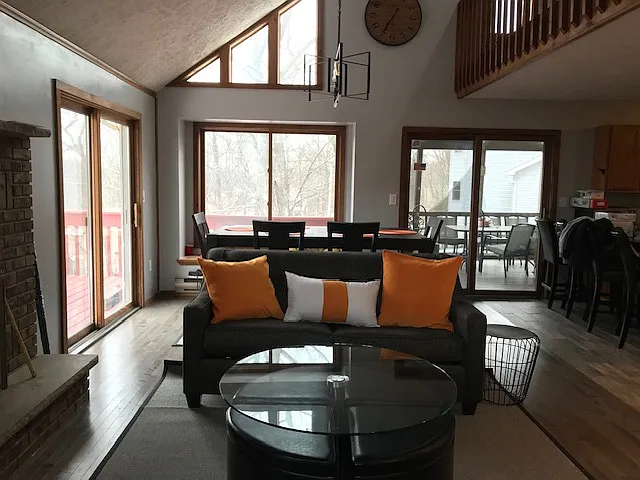 Living room view looking into ding room and kitchen space towards your right