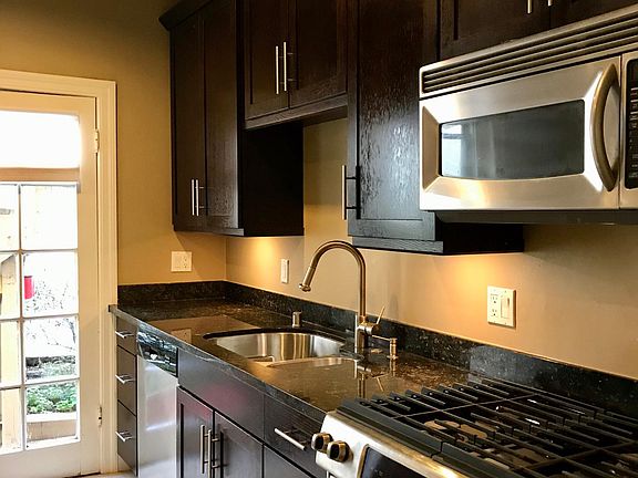 Ebonized Oak Cabinetry, Granite Counters