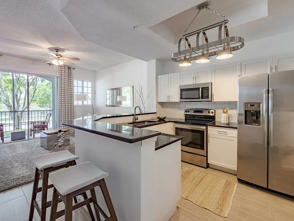 At Polo Lakes, the kitchen island adds space for preparation and casual seating.