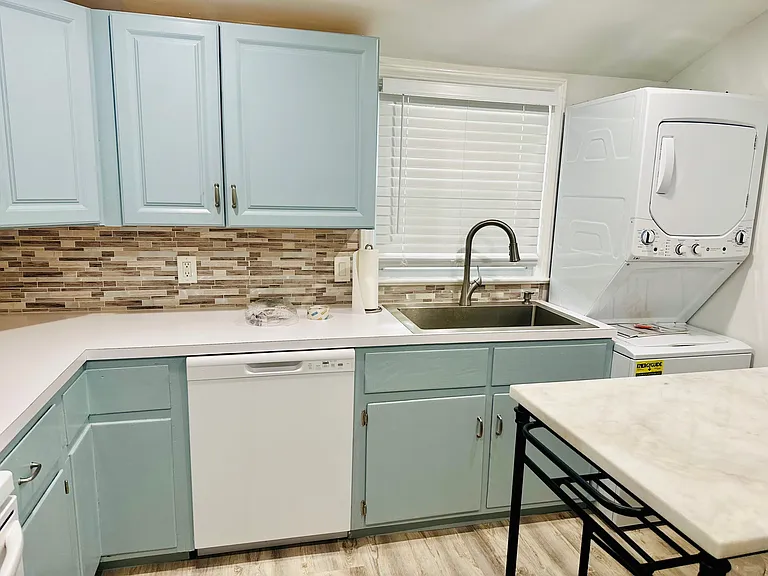 Recently painted cabinets and enough counter space for cooking.