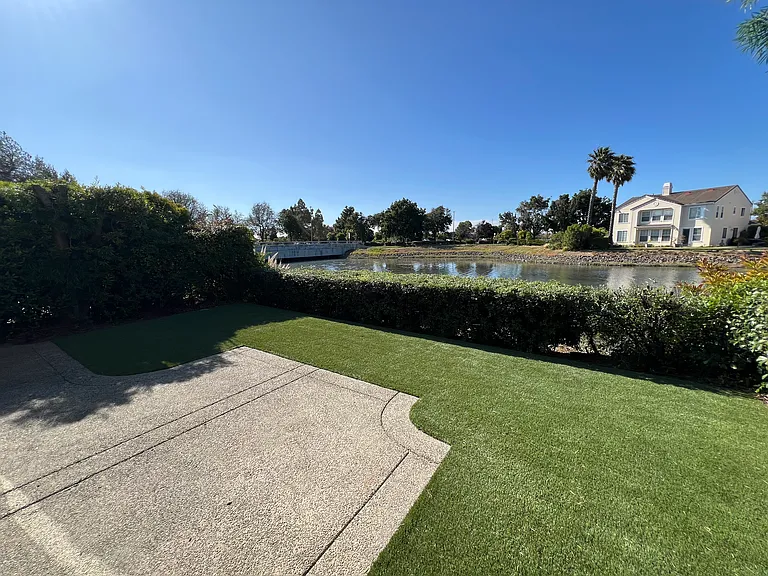 Patio and artificial turf on the backyard