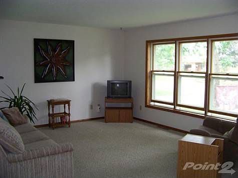 Open and spacious living room with large windows