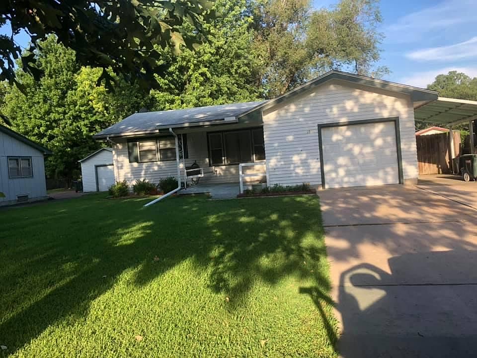 1827 N Sheridan, Wichita, KS. One car attached garage. Two car detached garage in back yard. Off-street parking. Beautiful lawn,