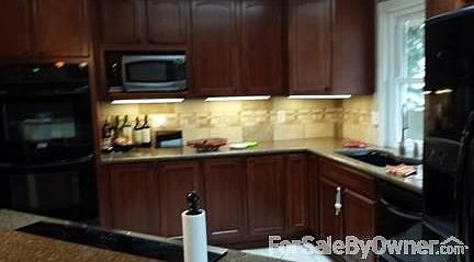 Upstairs Living Room
						:
						Open living, dining and kitchen concept. French doors lead to front deck.