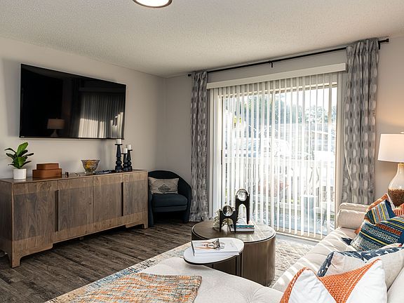 Spacious living room with hardwood-style flooring