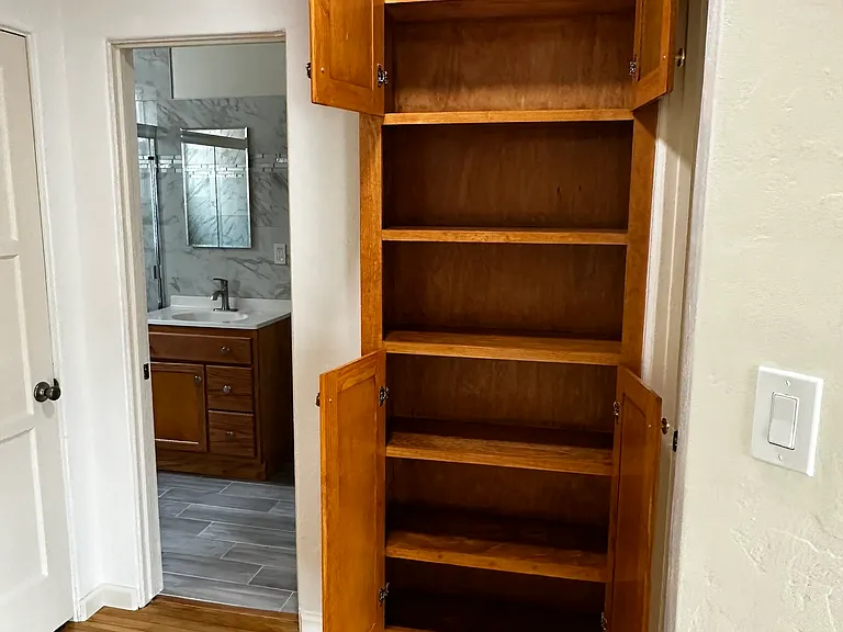 Hallway:

Bathroom on the Left

Right is Linen Cabinet, 
Book Shelves, & One outlet on side
of Book Shelf