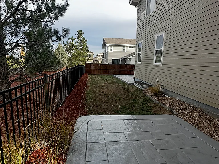 Side yard with stamped concrete