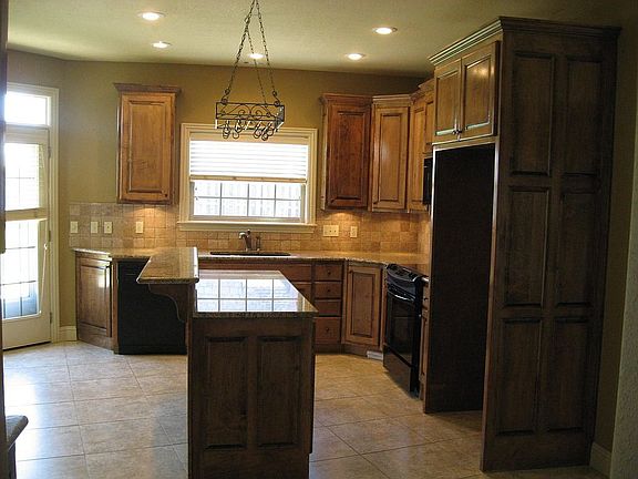 Large kitchen with island and granite counters
