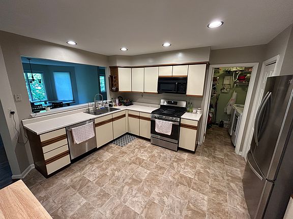 kitchen with walk-in laundry room