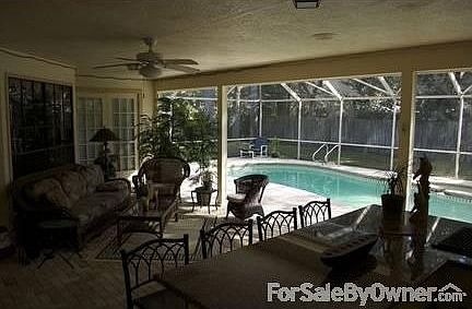 Screened pool area and covered patio : brick pavers throughout the pool area. Screened solar heated 