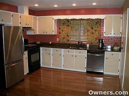 Open kitchen with granite countertops.