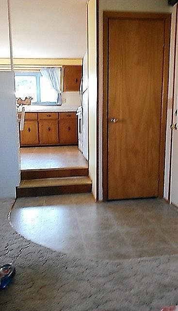 Entryway and stairs to kitchen