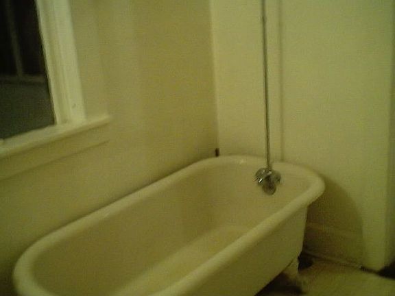 upstairs claw tub curtain rod window to back porch