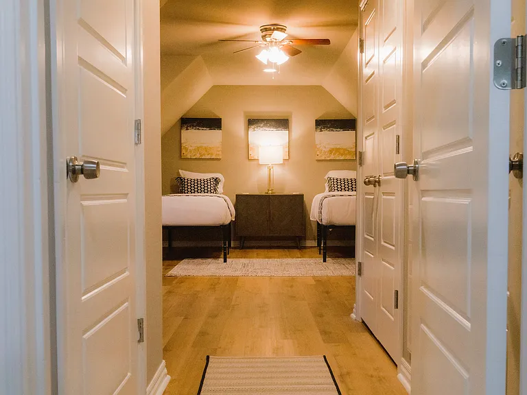 Lrg bedroom up. 2 twin XL beds. Can also be 2nd master suite if pushed together.