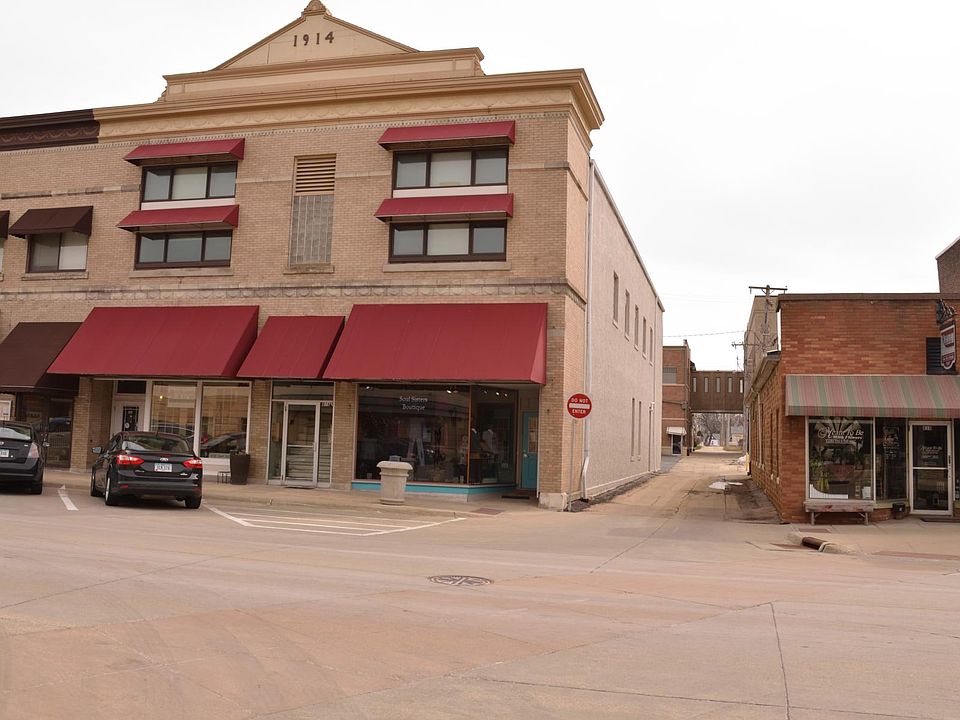 Overall Building Store Fronts below left and right Burgundy Awnings