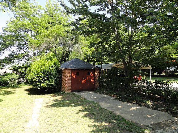 Small shed suitable for lawn mower equipment.