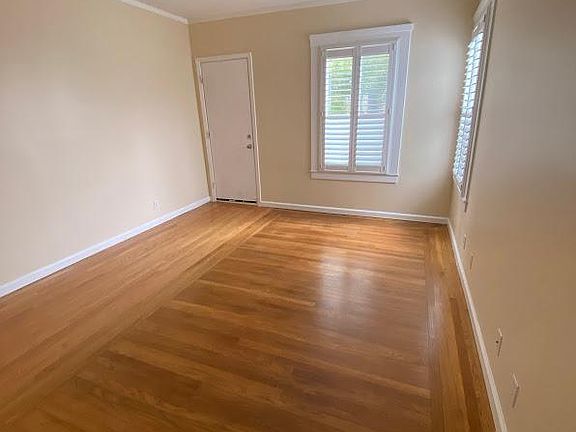 Bedroom #1 with stairs to backyard