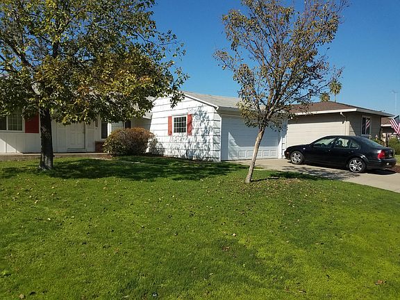 Before new paint and roof. Also, grass is no longer this nice.